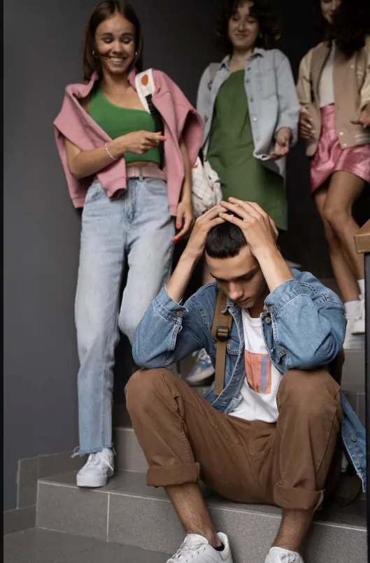 Project cover: a seated young person with their head in their hands and peers behind them.