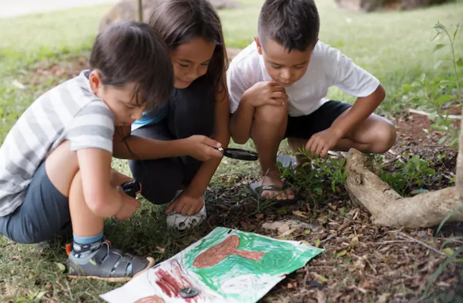 Students working on eco school projects exploring nature outdoors