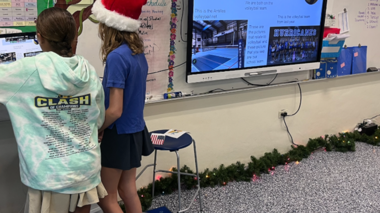 Two students presenting their volleyball hobby to a partner class in an international collaborative project on Class2Class